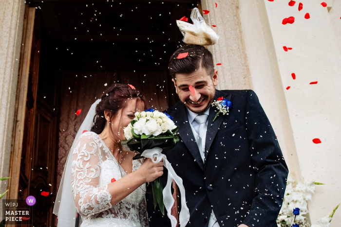 Photo by: <a href="https://www.wpja.com/contests/2019-v07/best-wedding-photographers/2499131">Melinda Guerini Temesi - Budapest Budapest</a> Lago di Orta, Italy Wedding Photography - church exit of bride and groom - just after the ceremony