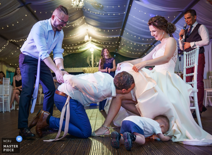 Photo by: <a href="https://www.wpja.com/contests/2019-v07/best-wedding-photographers/2499561">Boni Bonev - Sofia Sofia</a> Wedding Photo at Villa Ekaterina , Sofia, Bulgaria - Help for removing a garter