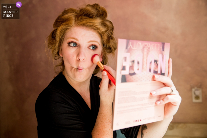 Photo of a North Lake Tahoe Bride putting on her own makeup 