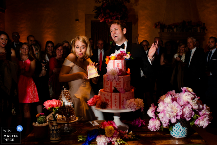 Photo by: <a href="https://www.wpja.com/contests/2019-v07/best-wedding-photographers/2502846">Siliang Wang - San Jose California</a> Monterey Peninsula Country Club - cake cutting photograph with the bride and groom