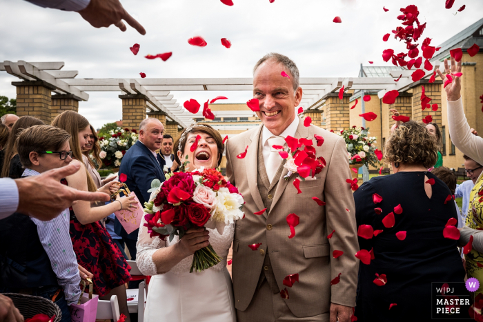 Photo by: <a href="https://www.wpja.com/contests/2019-v07/best-wedding-photographers/2503666">Marlies Dekker - Rotterdam Zuid Holland</a> Kasteel Dussen - Netherlands Wedding Photograph showing that kids will be kids - throwing of flower petals after ceremony