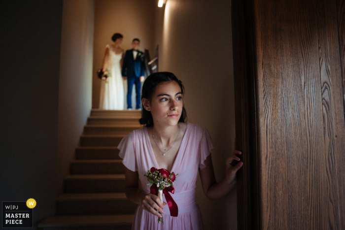 Photo by: <a href="https://www.wpja.com/contests/2019-v07/best-wedding-photographers/2504211">Mauro Santoro - Berlin Berlin</a> Reggio Calabria-Villa Tramontana Wedding Photographer | The bridesmaid looks timidly out before entering the scene