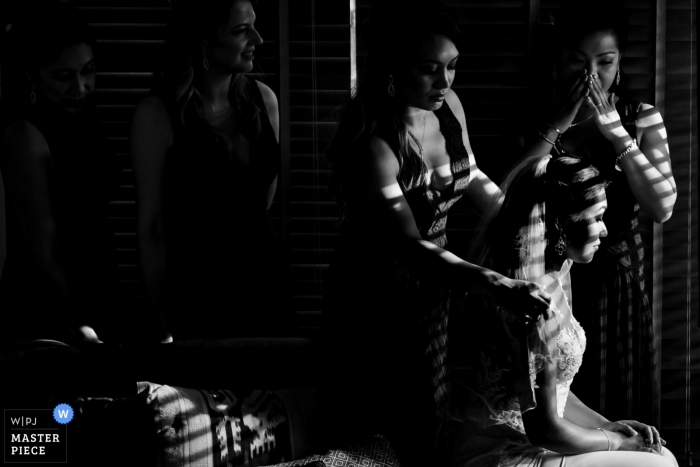 Photo by: <a href="https://www.wpja.com/contests/2019-v07/best-wedding-photographers/2504506">Stam Chananakhon - Phuket </a> Phuket, Thailand Bride and Bridesmaid Preparing for the Wedding Ceremony