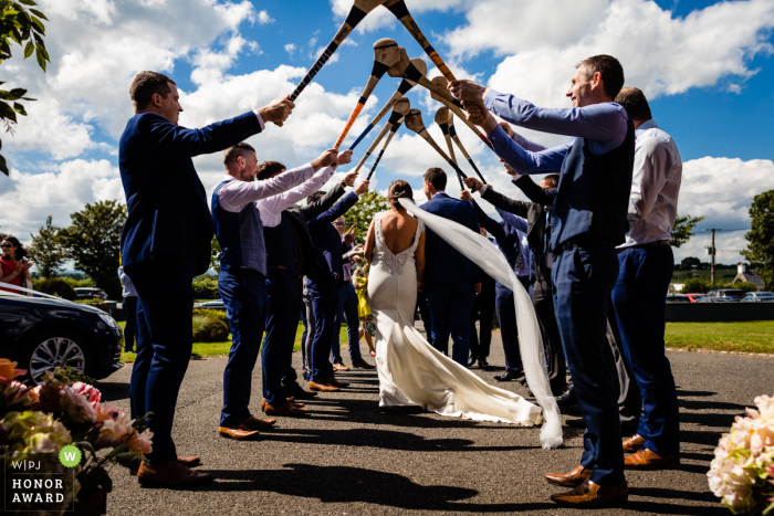 Tipperary, Ireland wedding photos at the Ashley Park House | Guard of honour with hurley sticks 