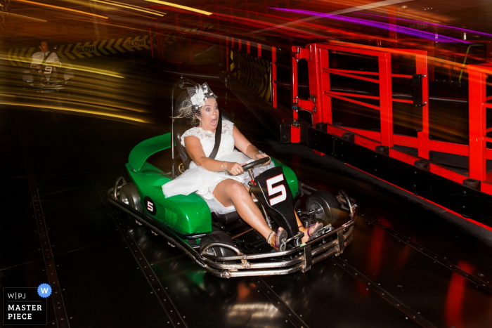 Photo by: <a href="https://www.wpja.com/contests/2019-v07-photography-competition/best-wedding-photographers/2507521">Martin Dabek - Bristol Bristol</a> The Grand Pier Go-Kart Photography - The wedding reception was at theme park, so the couple had some fun before the evening due