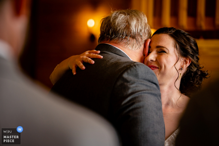 Photo by: <a href="https://www.wpja.com/contests/2019-v07/best-wedding-photographers/2508131">Brittany Diliberto - Arlington Virginia</a> Stoneyman Ranch, Luray, Virginia Wedding Photography | bride hugs her father after he walks her down the aisle