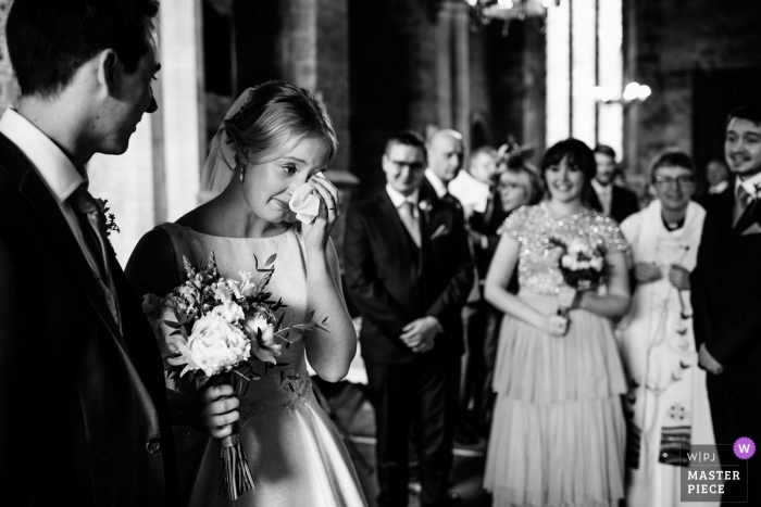Photo by: <a href="https://www.wpja.com/contests/2019-v08/best-wedding-photographers/2510351">Aaron Storry - Kettering Northamptonshire</a> Yelling, Northamptonshire, United Kingdom - Photo of Emotional bride leaving the church