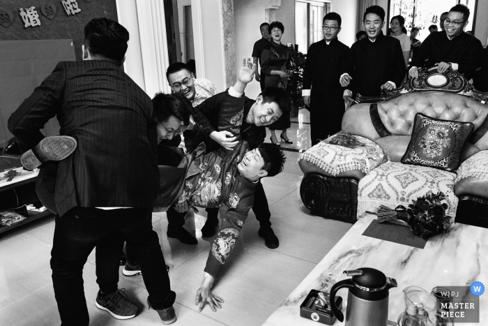 Photo by: <a href="https://www.wpja.com/contests/2019-v08/best-wedding-photographers/2511876">Xiaozhu Lin - Beijing </a> The fallen groom at the Dezhou Jiulongwan Shengtaiyuan - Wedding Photography