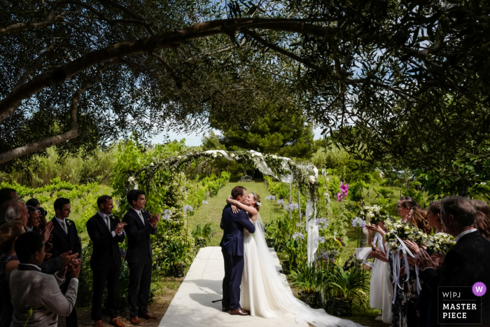 Photo by: <a href="https://www.wpja.com/contests/2019-v08/best-wedding-photographers/2512111">William Lambelet - Montpellier </a> Ceremony kiss under olive tree at the Chateau du Puits es Pratx, Ginestas, FRANCE