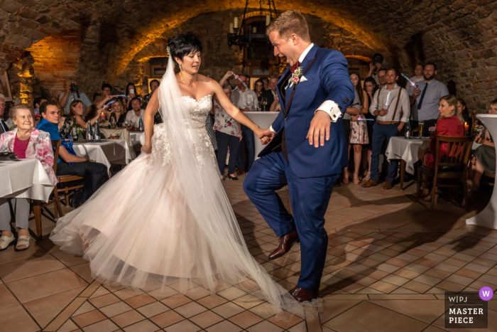 Photo by: <a href="https://www.wpja.com/contests/2019-v08/best-wedding-photographers/2514246">David Anton - Oberkirch </a> Zell am Harmersbach Wedding Venue Photographer - Groom stepping on the bride's dress during the first dance