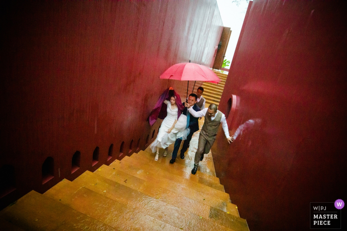 The Ritz-Carlton, Krabi, Thailand Wedding Venue Photography - The bride and groom insisted on going to the wedding ceremony venue during the rainstorm. 