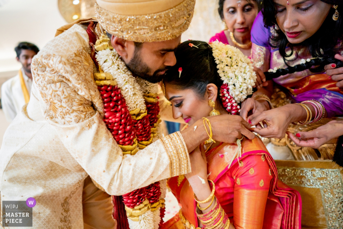 Photo by: <a href="https://www.wpja.com/contests/2019-v08/best-wedding-photographers/2518801">Sheraz Khwaja - Ilfod Essex</a> Oshwal Temple, London Wedding Photograph of Thali moment