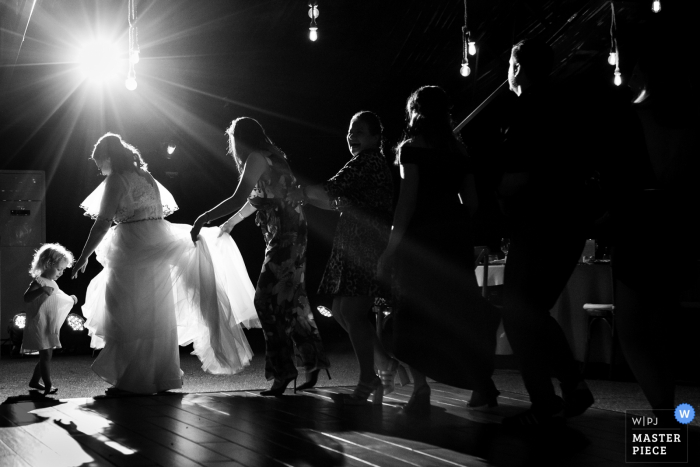 Photo by: <a href="https://www.wpja.com/contests/2019-v08/best-wedding-photographers/2520016">Cristina Tanase - București</a> Photo of the Bride and guest dancing during the reception party at Padurile Regale