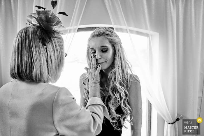 Photo by: <a href="https://www.wpja.com/contests/2019-v08/best-wedding-photographers/2520266">Clive Blair - Birmingham West Midlands</a> Bordesley Park Wedding Day Photography | Bride's mother wiping away the bride's wedding day tears