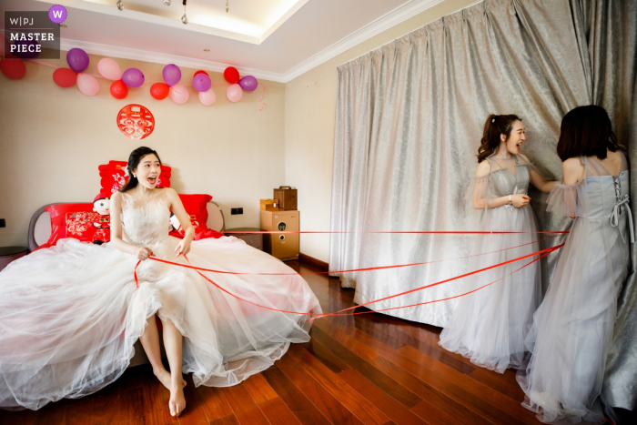 Photo by: <a href="https://www.wpja.com/contests/2019-v09/best-wedding-photographers/2534716">Yudi Shao - Hangzhou </a> Chinese traditional games at a Fuyang wedding.