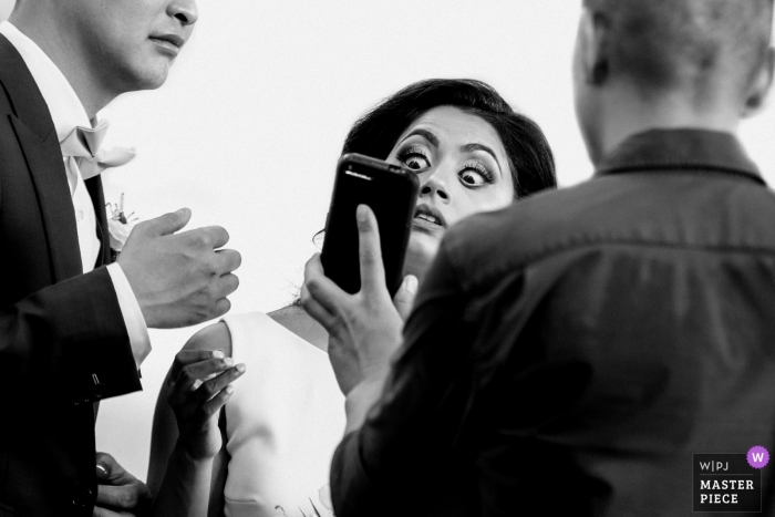 Photo by: <a href="https://www.wpja.com/contests/2019-v09/best-wedding-photographers/2535911">Cafa Liu - Richmond Hill Ontario</a> BELCROFT ESTATE&EVENT CENTRE - Wedding Photography - The bride was looking at something on the phone