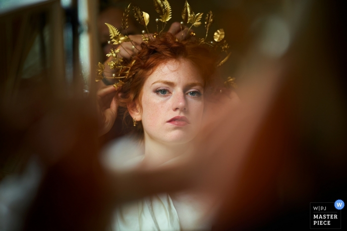 Photo by: <a href="https://www.wpja.com/contests/2019-v09/best-wedding-photographers/2536676">Martin Beddall - Horsham West Sussex</a> Parents garden, Clayton, UK Wedding Photographer - Bride watches in the mirror, as her homemade head dress goes on