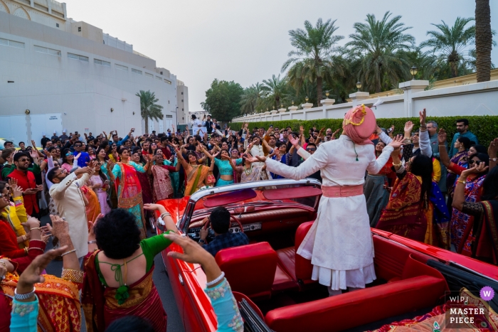 The groom with his entourage dancing his way in to the wedding venue Sofitel Hotel, Bahrain Wedding Photojournalism | The groom with his entourage dancing his way in to the wedding venue.