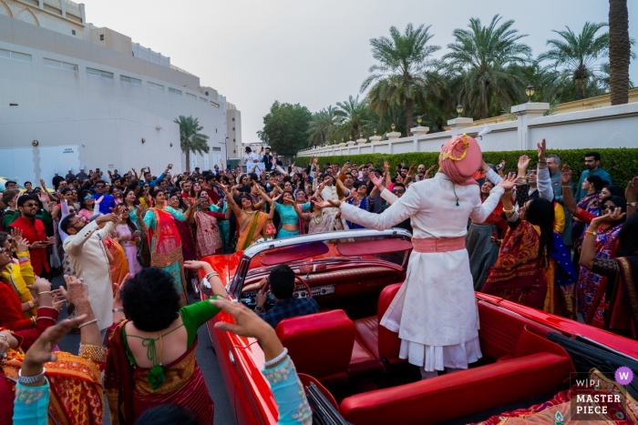 Sofitel Hotel, Bahrain Wedding Photojournalism | The groom with his entourage dancing his way in to the wedding venue. 