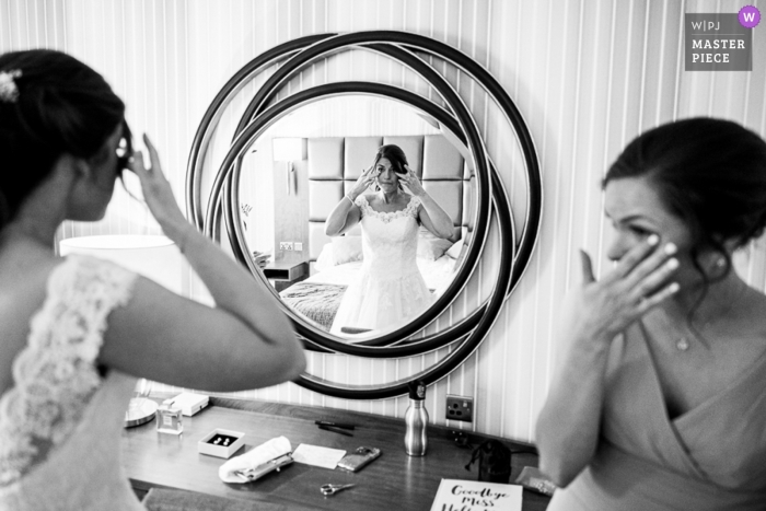 Photo by: <a href="https://www.wpja.com/contests/2019-v09/best-wedding-photographers/2537576">Tom Beynon - Cambridge Cambridgeshire</a> Belton Woods Hotel, Grantham Wedding Venues - Photography of The bride and bridesmaid wipe away a tear during bride prep