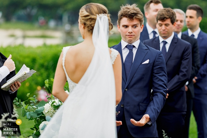 Photo by: <a href="https://www.wpja.com/contests/2019-v09/best-wedding-photographers/2538416">Alex Paul - Boston Massachusetts</a> Photo showing the grooms reaction during the ceremony at Nantucket, MA White Elephant