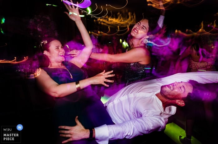 Photo by: <a href="https://www.wpja.com/contests/2019-v09/best-wedding-photographers/2538741">Vlad Lodoaba - București</a> Bamboo Club, Bucharest - Guests on the dancefloor at a wedding capured by wedding photographer's slow-shutter