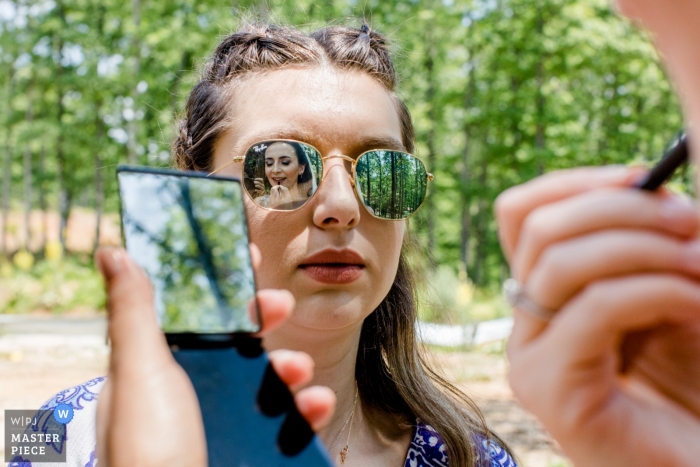 Bursa-Konak 18 Wedding Photos - Make Up for bride in mirror and mirror sunglasses.