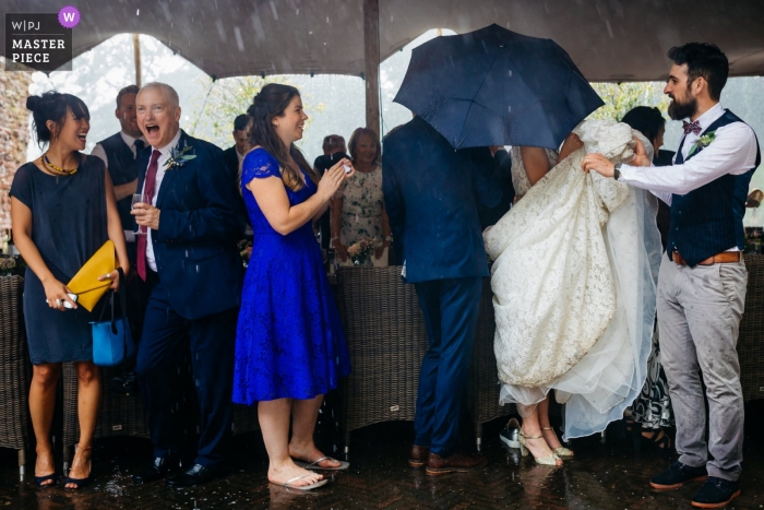 Photo by: <a href="https://www.wpja.com/contests/2019-v09/best-wedding-photographers/2540486">Leonard Walpot - Utrecht Utrecht</a> Kasteel Duurstede Wedding Photojournalism - The hailstorm during the entrance of the bride and groom