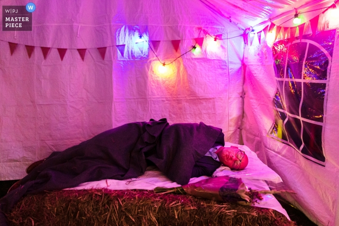 Photo by: <a href="https://www.wpja.com/contests/2019-v09/best-wedding-photographers/2540691">Philippe Swiggers - Bekkevoort </a> Spiegeltent Glabbeek Wedding Reception Photographer - A Finished guest grabs some rest