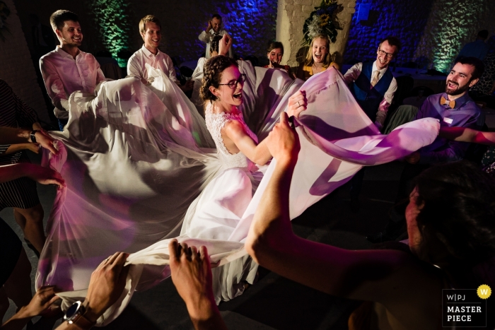 Photo by: <a href="https://www.wpja.com/contests/2019-v09/best-wedding-photographers/2541451">Simon Leclercq - Leuven Vlaams Brabant</a> Corroy Le Grand Wedding Photos - Dress Fun on the dance floor with the bride and guests