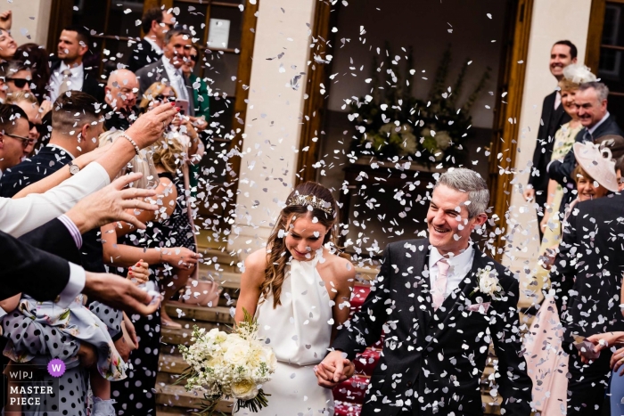 Photo by: <a href="https://www.wpja.com/contests/2019-v10/best-wedding-photographers/2543335">Liam Collard - Phuket Phuket</a> London, UK wedding reportage photos of confetti over bride and groom