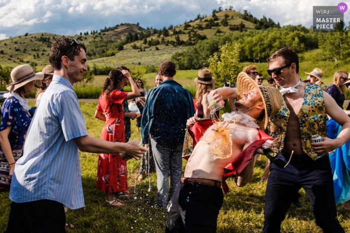 Photo by: <a href="https://www.wpja.com/contests/2019-v10/best-wedding-photographers/2543628">David Clumpner - Missoula Montana</a> Rocky Creek Farm - Bozeman, Montana wedding photos of drunk guests having fun