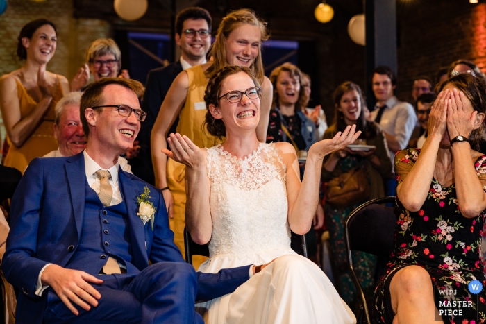 Photo by: <a href="https://www.wpja.com/contests/2019-v10/best-wedding-photographers/2543771">Simon Leclercq - Leuven Vlaams Brabant</a> Ferme Du Chateau de Corroy le grand wedding reception photography of bride, groom and guests laughing.