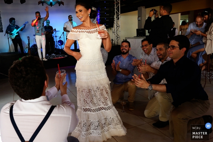 Photo by: <a href="https://www.wpja.com/contests/2019-v10/best-wedding-photographers/2543940">Claudia Amorim - Goiânia Goias</a> Recanto São Bento Wedding Photo of the Bride on the Dance Floor with the Band behind.
