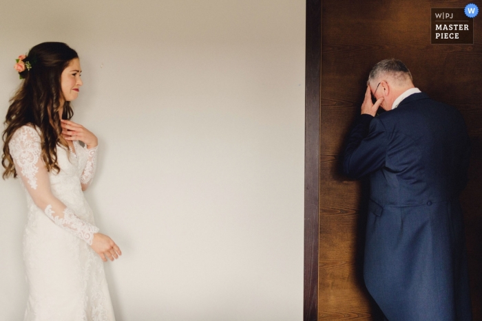 Photo by: <a href="https://www.wpja.com/contests/2019-v11/best-wedding-photographers/2544465">Ashley Davenport - Castle Dongington Derbyshire</a> London, England Wedding Reportage Photography | Father of the bride breaking down after seeing his daughter for the first time