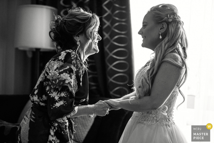 Photo by: <a href="https://www.wpja.com/contests/2019-v11/best-wedding-photographers/2545793">Alex Paul - Boston Massachusetts</a> Wedding Photographer Images from Kimpton Marlowe Hotel Cambridge - Mom helps her daughter to get ready