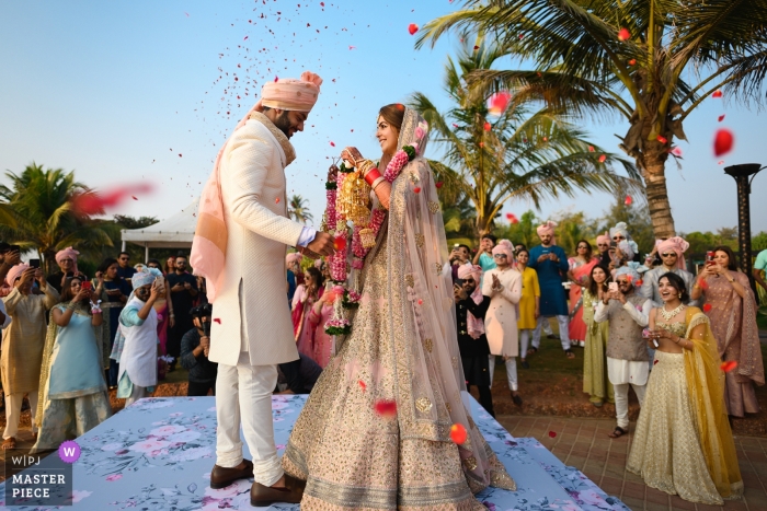 During the exchange of garlands in an Indian wedding Holiday Inn, Goa, India Wedding Ceremony Photographer | During the exchange of garlands in an Indian wedding.