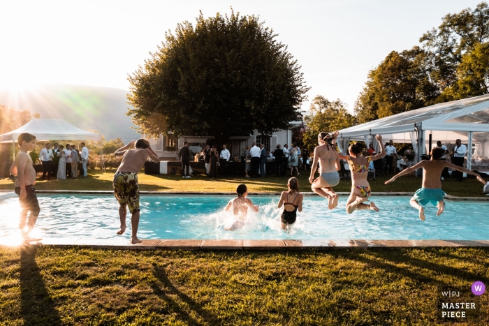 Photo by: <a href="https://www.wpja.com/contests/2019-v12/best-wedding-photographers/2548005">Jonathan Sylvoz - Annecy </a> Wedding reception pool party photo of the children playing in the pool during the cocktail
