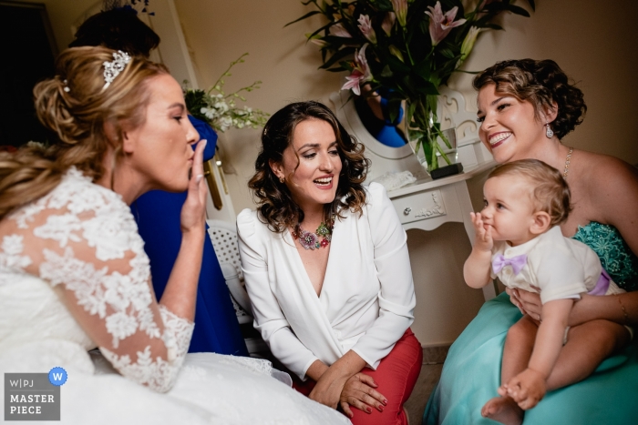 Bride and her family during getting ready Madrid, Spain wedding photograph of Bride and her family during getting ready