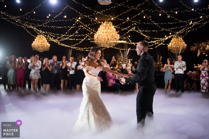 Melbourne First dance photography from the foggy wedding reception dance floor. 