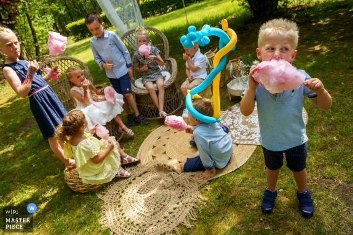 Photo by: <a href="https://www.wpja.com/contests/2019-v12/best-wedding-photographers/2548521">Indra Simons - Enschede Overijssel</a> Outdoor Wedding Reception Photography at De Lutte, Jan Wesselinkhoes - Kids eating candy cotton, with joy