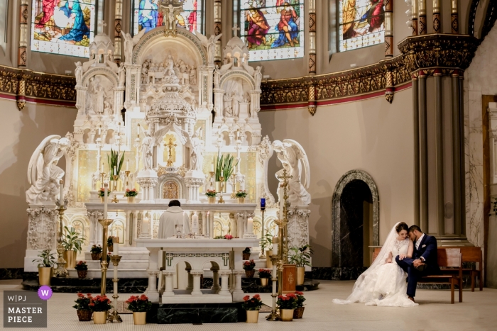 Photo by: <a href="https://www.wpja.com/contests/2019-v13/best-wedding-photographers/2549526">Tamara Gavrilovic - Chicago Illinois</a> Ceremony Photography from the Wedding at St. Vincent de Paul church, Chicago. Bride and groom in the church