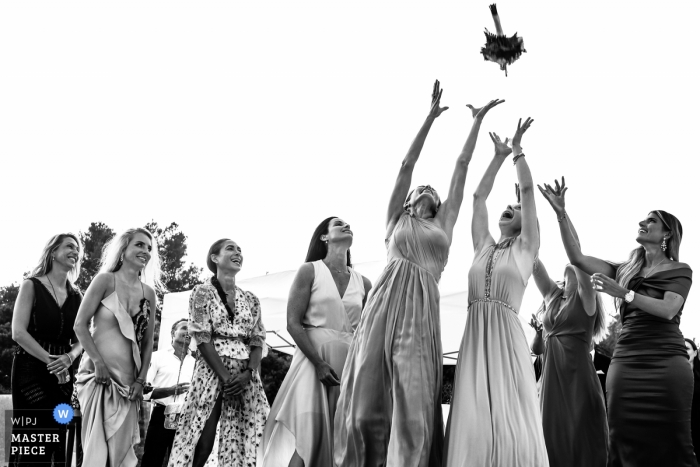 Photo by: <a href="https://www.wpja.com/contests/2019-v13/best-wedding-photographers/2549873">Rocio Vega Roa - Ponferrada Leon</a> SAINT TROPEZ private chateau wedding photo of the bouquet toss in black and white