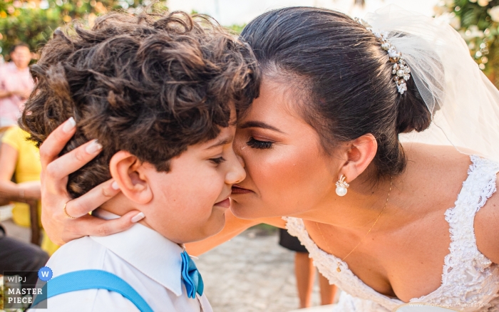 Photo by: <a href="https://www.wpja.com/contests/2019-v13/best-wedding-photographers/2550120">Monica Guimaraes - Maceió Alagoas</a> Brazil Ceremony Photography of the Outdoor Wedding - Emotion to receive the rings