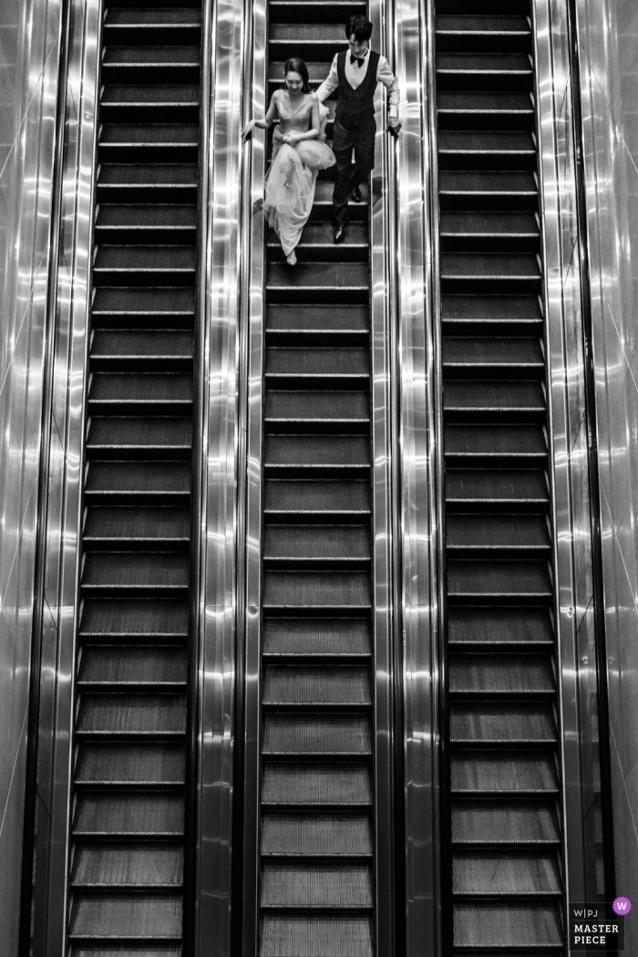 Guangdong Hotel bride and groom on stairs Guangdong Hotel Wedding ceremony completed - China Wedding Photographer