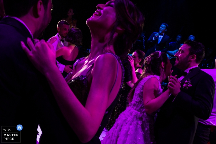Photo by: <a href="https://www.wpja.com/contests/2019-v13/best-wedding-photographers/2551259">Miguel Onieva - Madrid Madrid</a> Spain Wedding Reception Photography in Purple - party layers with dancing couples with musicians