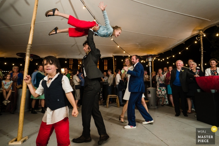 Photo by: <a href="https://www.wpja.com/contests/2019-v13/best-wedding-photographers/2551287">Simon Leclercq - Leuven Vlaams Brabant</a> Wedding Photography of Children at Grez Doiceau - Flying Kids on the Reception Dance Floor under the Tent