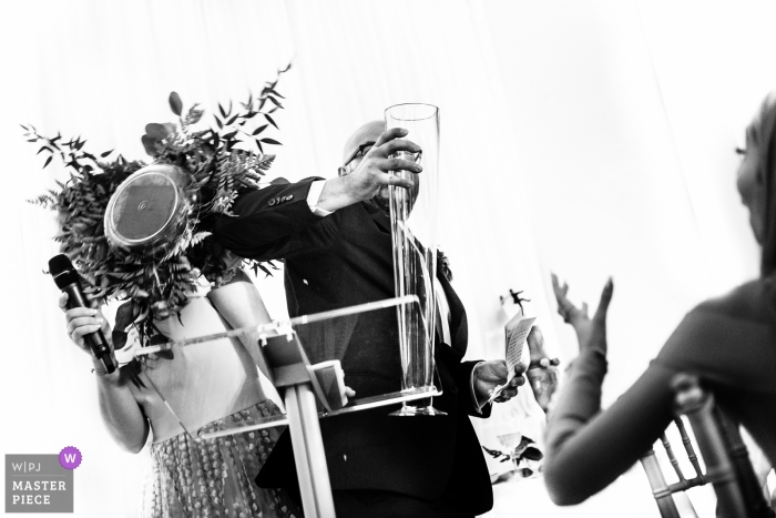 Cambridge Butterfly Conservatory, Cambridge, ON Wedding Venue Photos - The groom makes the flowers fall down during the thank you speech 