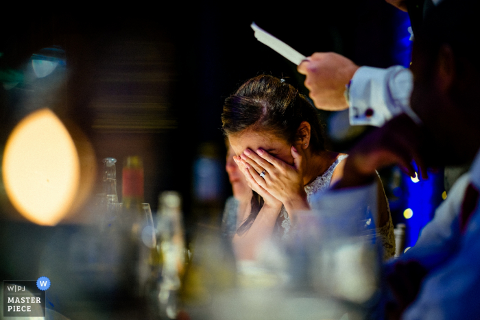 Photo by: <a href="https://www.wpja.com/contests/2019-v13/best-wedding-photographers/2551402">Paul Rogers - Hitchin Hertfordshire</a> Wedding Venue Photography from The Brewery, London, UK | The Bride cringes as her husband delivers his wedding speech.