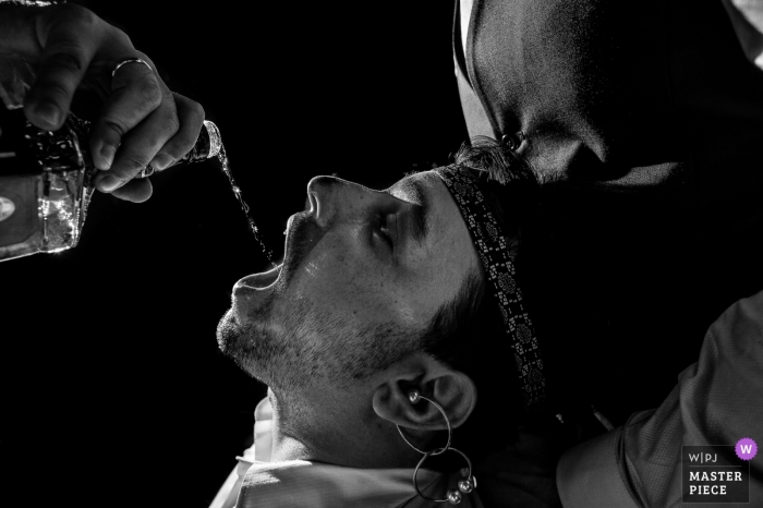 Photo by: <a href="https://www.wpja.com/contests/2019-v13/best-wedding-photographers/2551483">Vinicius Fadul - Campinas São Paulo</a> Paulinia Wedding Photography - Image contains: man, hands, liquor
